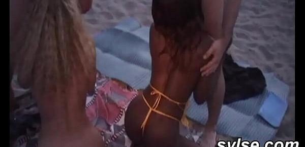  Amateur lesbians caught by pervert voyeurs on beach